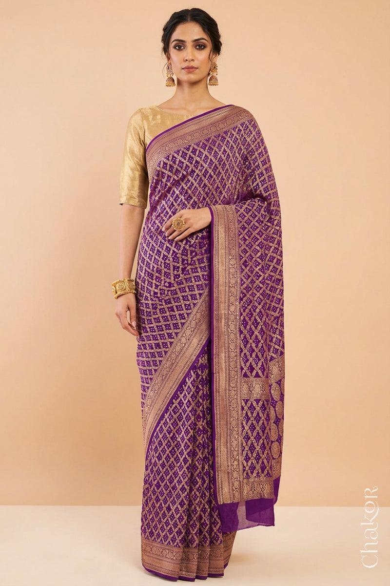 Woman wearing Handcrafted Purple Bandhani Banarasi Georgette Saree in pure silk featuring zari weaving and Kutch Bandhej for weddings and occasions.