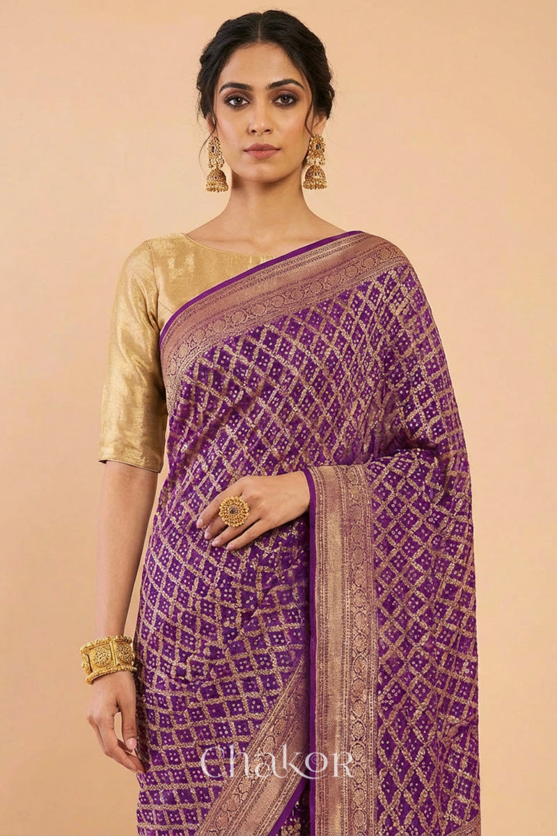 Woman wearing Handcrafted Purple Bandhani Banarasi Georgette Saree in pure silk featuring zari weaving and Kutch Bandhej for weddings and occasions.