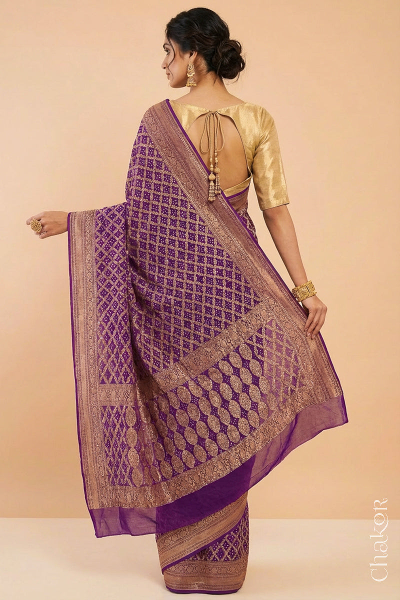 Woman wearing Handcrafted Purple Bandhani Banarasi Georgette Saree in pure silk featuring zari weaving and Kutch Bandhej for weddings and occasions.
