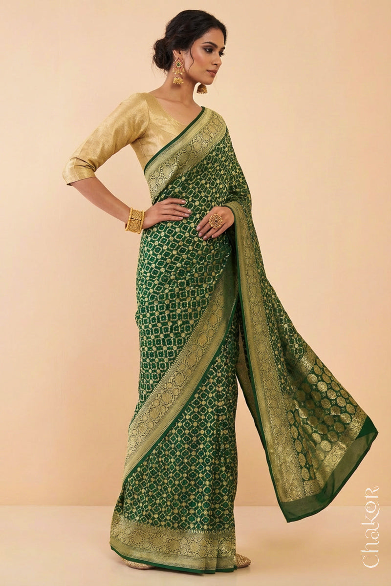 Woman wearing Handcrafted Green Bandhani Banarasi Georgette Saree in pure silk featuring zari weaving and Kutch Bandhej for weddings and occasions.
