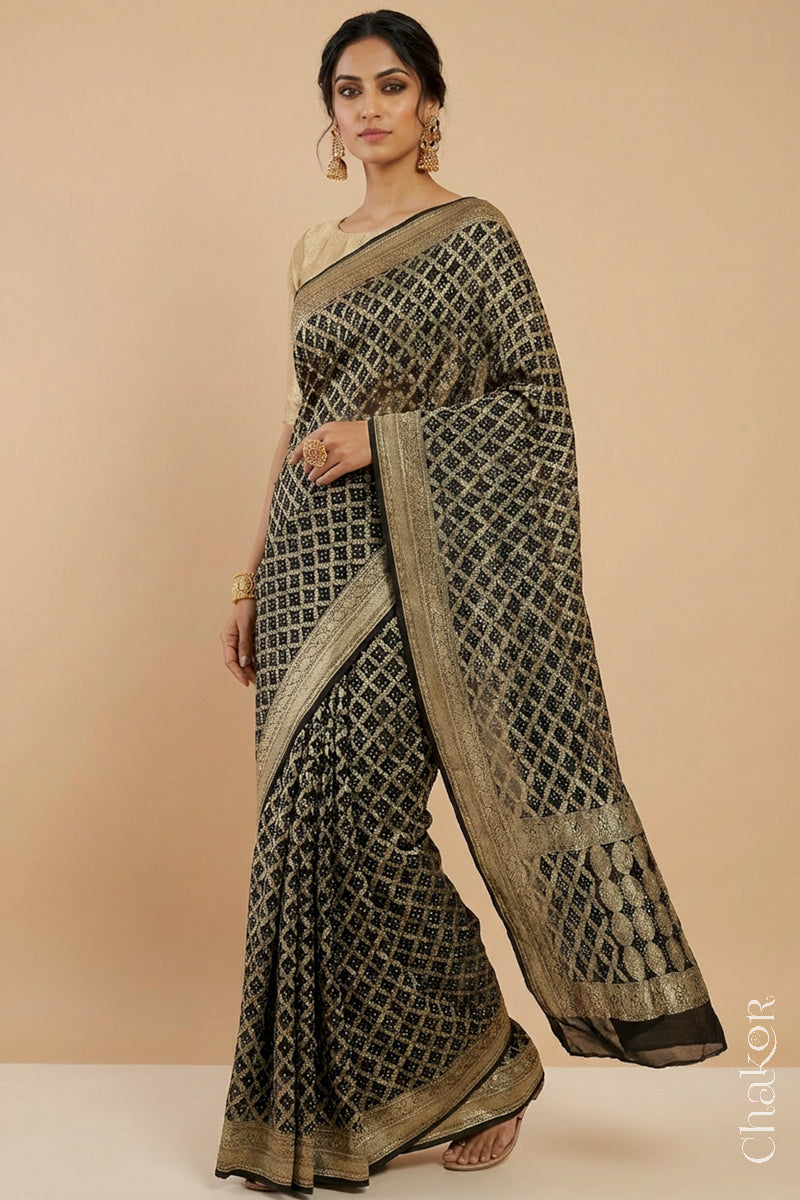 Woman wearing Handcrafted Black Bandhani Banarasi Georgette Saree in pure silk featuring zari weaving and Kutch Bandhej for weddings and occasions.