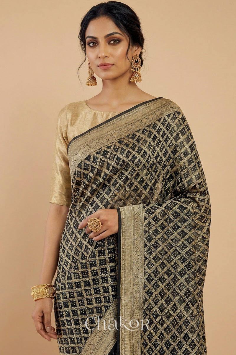 Woman wearing Handcrafted Black Bandhani Banarasi Georgette Saree in pure silk featuring zari weaving and Kutch Bandhej for weddings and occasions.