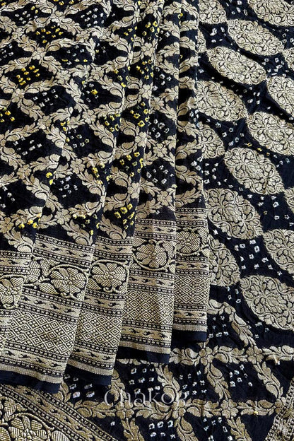 Close up of Handcrafted Black Bandhani Banarasi Georgette Saree in pure silk featuring zari weaving and Kutch Bandhej for weddings and occasions.