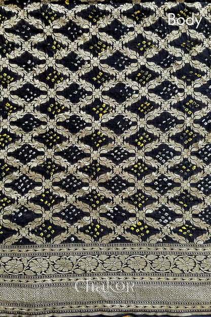 Close up of Handcrafted Black Bandhani Banarasi Georgette Saree in pure silk featuring zari weaving and Kutch Bandhej for weddings and occasions.