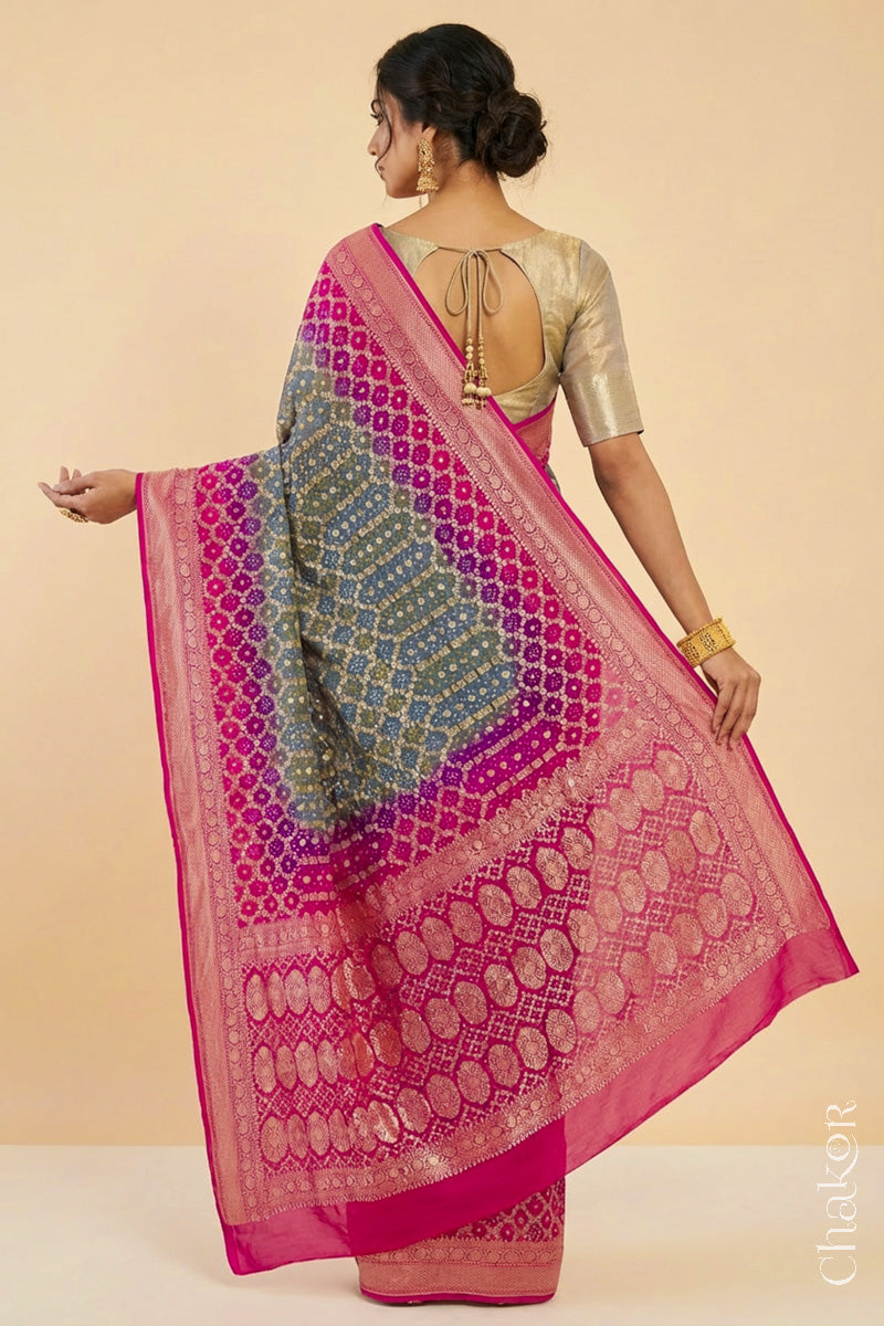 Woman wearing Handcrafted Pink and grey ombre shaded Bandhani Banarasi Georgette Silk Saree featuring zari weaving and Kutch Bandhej.