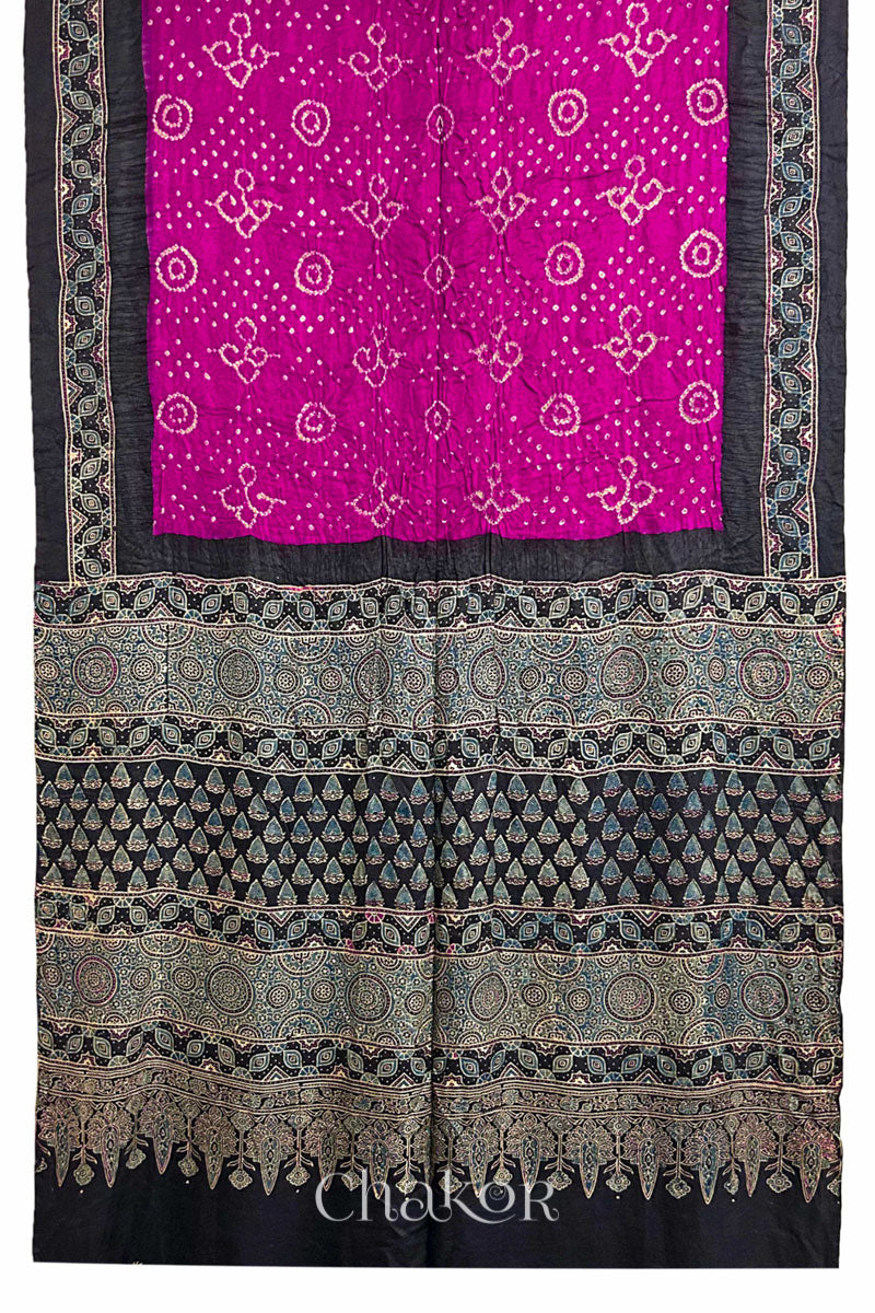 Full view of Pink Bandhani Saree with Black Ajrakh printed border and pallu in pure gaji silk with traditional bandhej tie-dye, handcrafted in Kutch. 