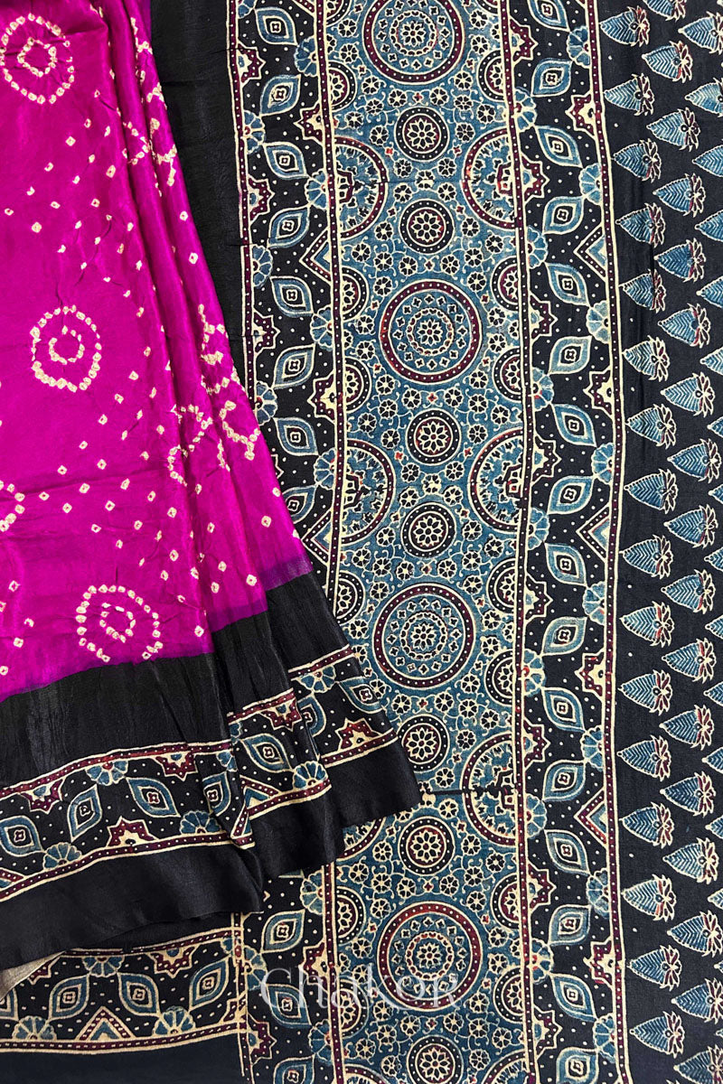 Close up of Pink Bandhani Saree with Black Ajrakh printed border and pallu in pure gaji silk with traditional bandhej tie-dye, handcrafted in Kutch. 