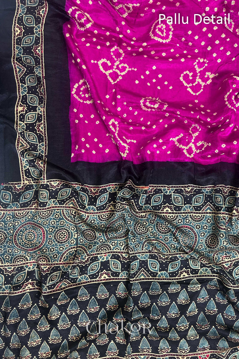 Close up of Pink Bandhani Saree with Black Ajrakh printed border and pallu in pure gaji silk with traditional bandhej tie-dye, handcrafted in Kutch. 