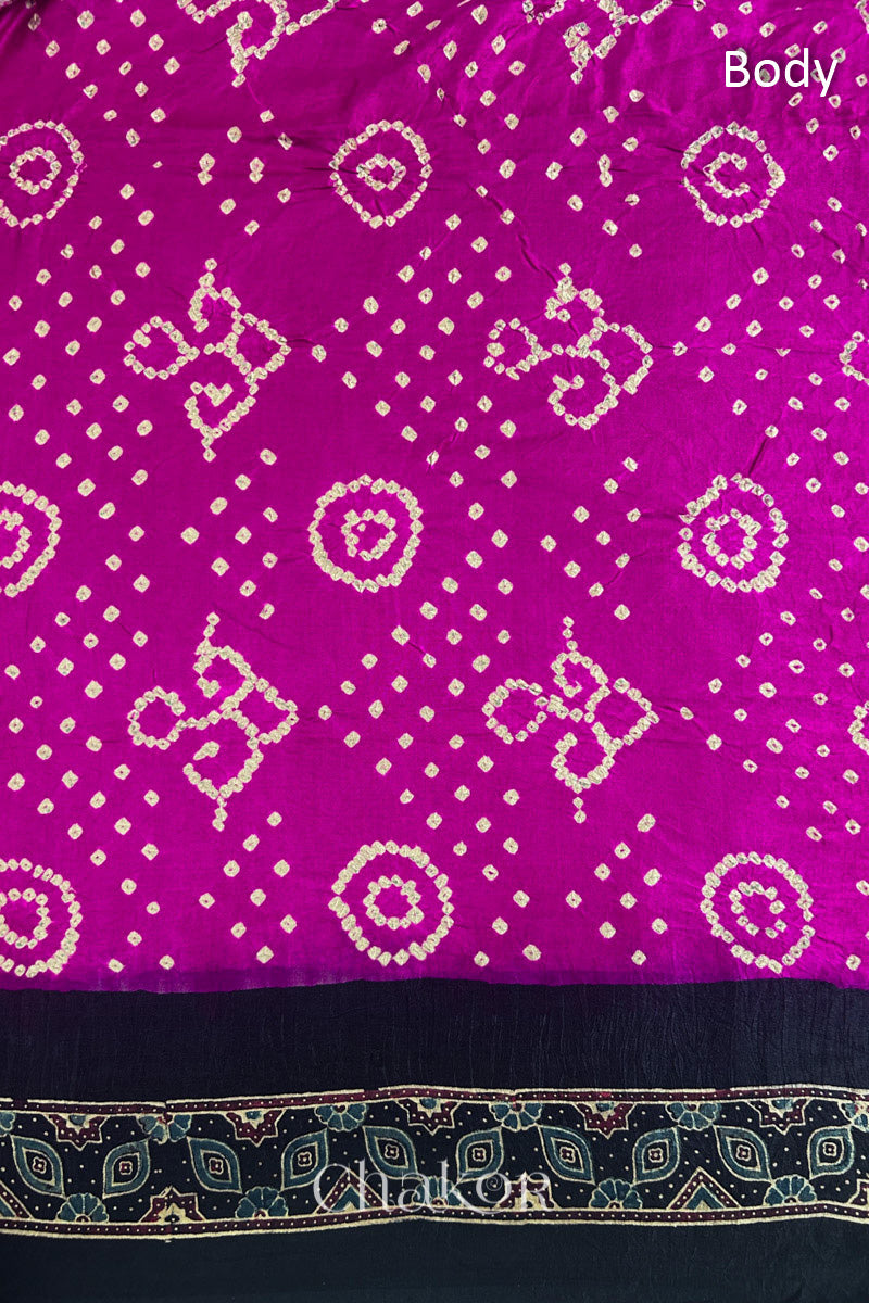 Close up of Pink Bandhani Saree with Black Ajrakh printed border and pallu in pure gaji silk with traditional bandhej tie-dye, handcrafted in Kutch. 
