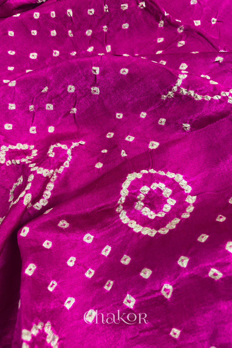 Close up of Pink Bandhani Saree with Black Ajrakh printed border and pallu in pure gaji silk with traditional bandhej tie-dye, handcrafted in Kutch. 