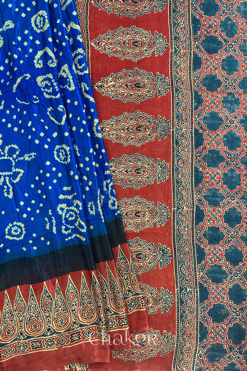 Close up of Blue Bandhani Saree with Natural Red Ajrakh printed border and pallu in pure gaji silk with traditional bandhej tie-dye, handcrafted in Kutch. 