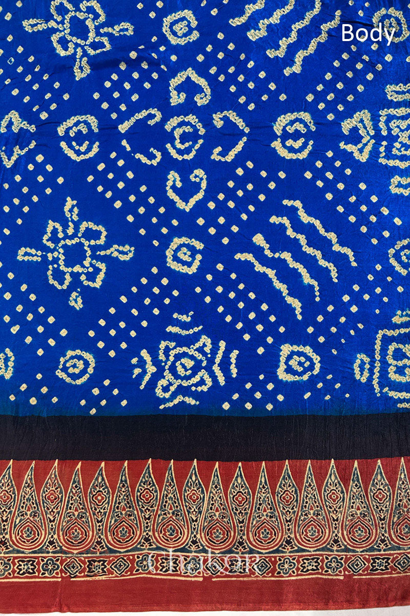 Close up of Blue Bandhani Saree with Natural Red Ajrakh printed border and pallu in pure gaji silk with traditional bandhej tie-dye, handcrafted in Kutch. 