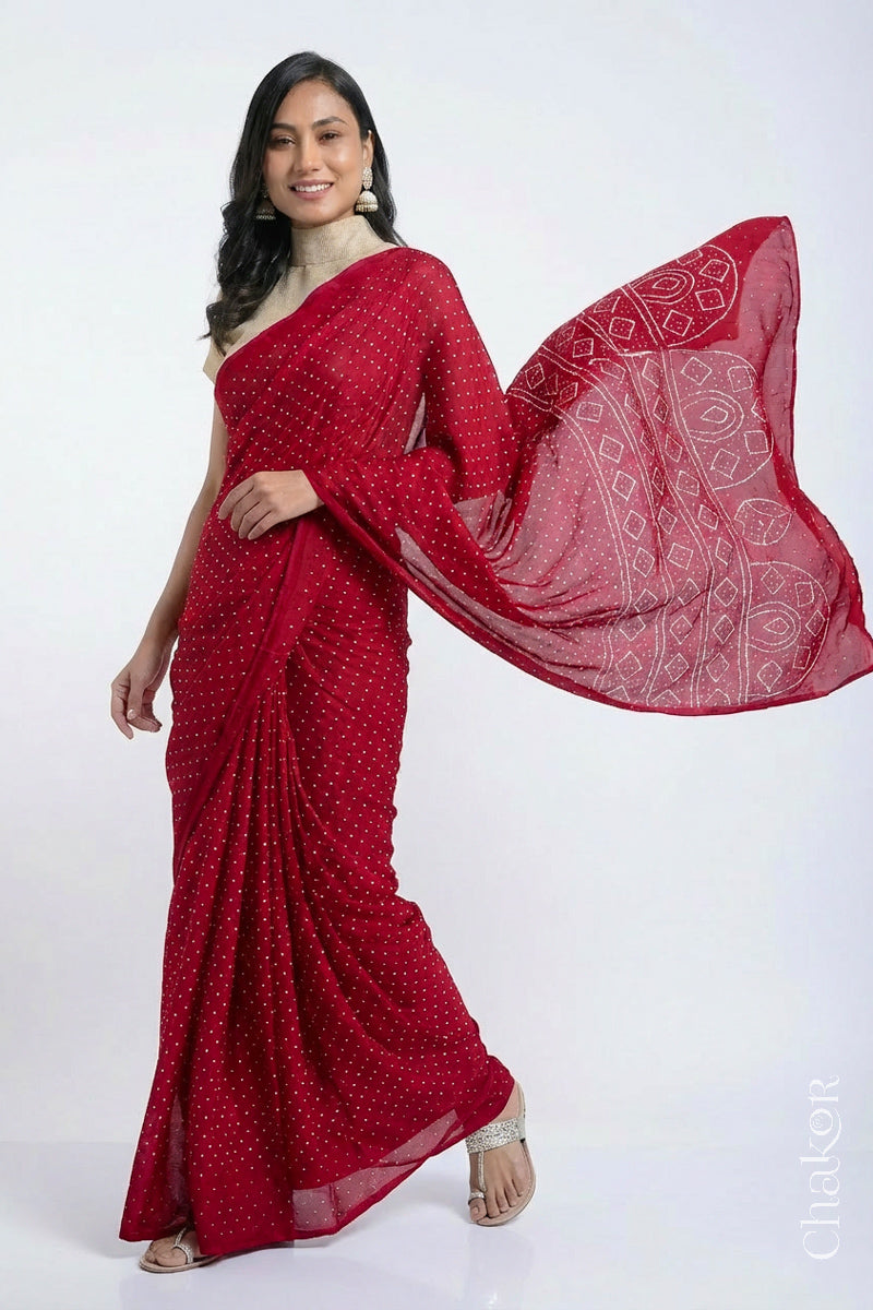 Model wearing Red Bandhani Mulberry Silk Saree, handcrafted in rai bandhej patterns with mukaish embroidery.