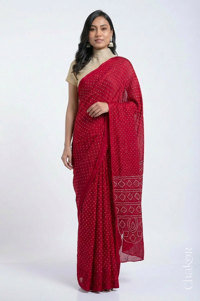 Model wearing Red Bandhani Mulberry Silk Saree, handcrafted in rai bandhej patterns with mukaish embroidery.