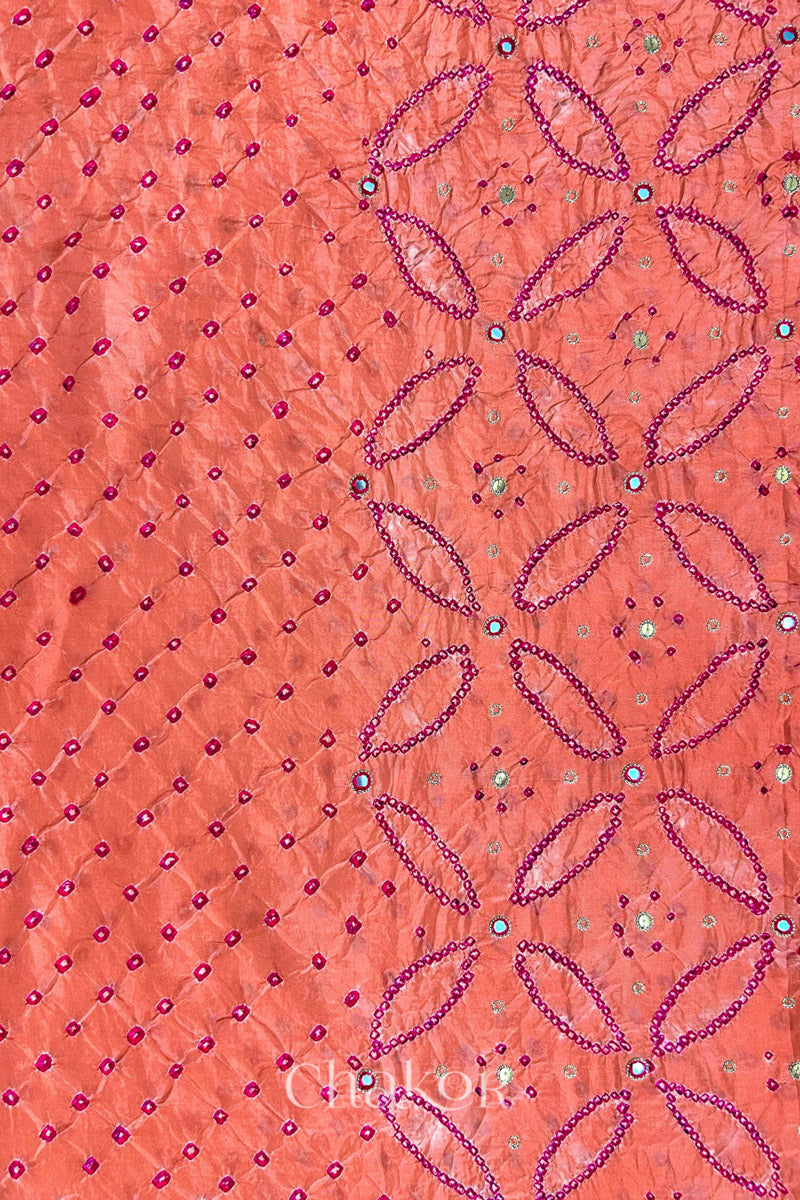 Coral pink mulberry silk Bandhani (Rai Bandhej) fabric showing full layout with rani pink tie-dye dots, floral bandhej pattern, and pink with zari mirror & sequins embroidery – CHAKOR.
