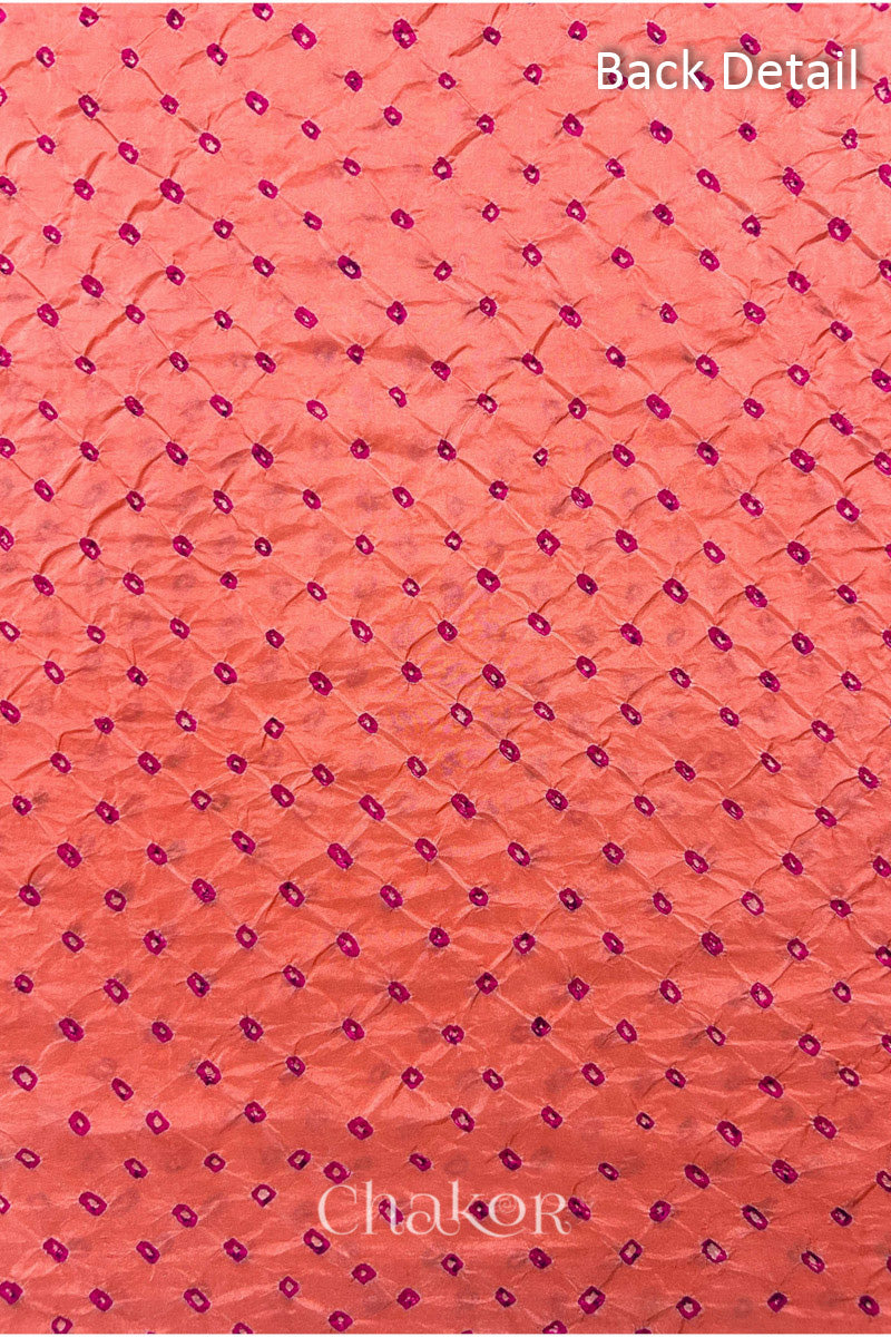 Back detail of Coral pink mulberry silk Bandhani (Rai Bandhej) fabric with rani pink tie-dye dots in an all-over pattern – CHAKOR.

