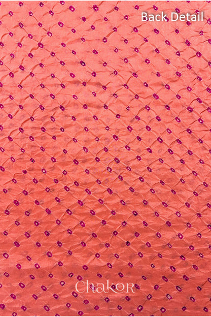 Back detail of Coral pink mulberry silk Bandhani (Rai Bandhej) fabric with rani pink tie-dye dots in an all-over pattern – CHAKOR.
