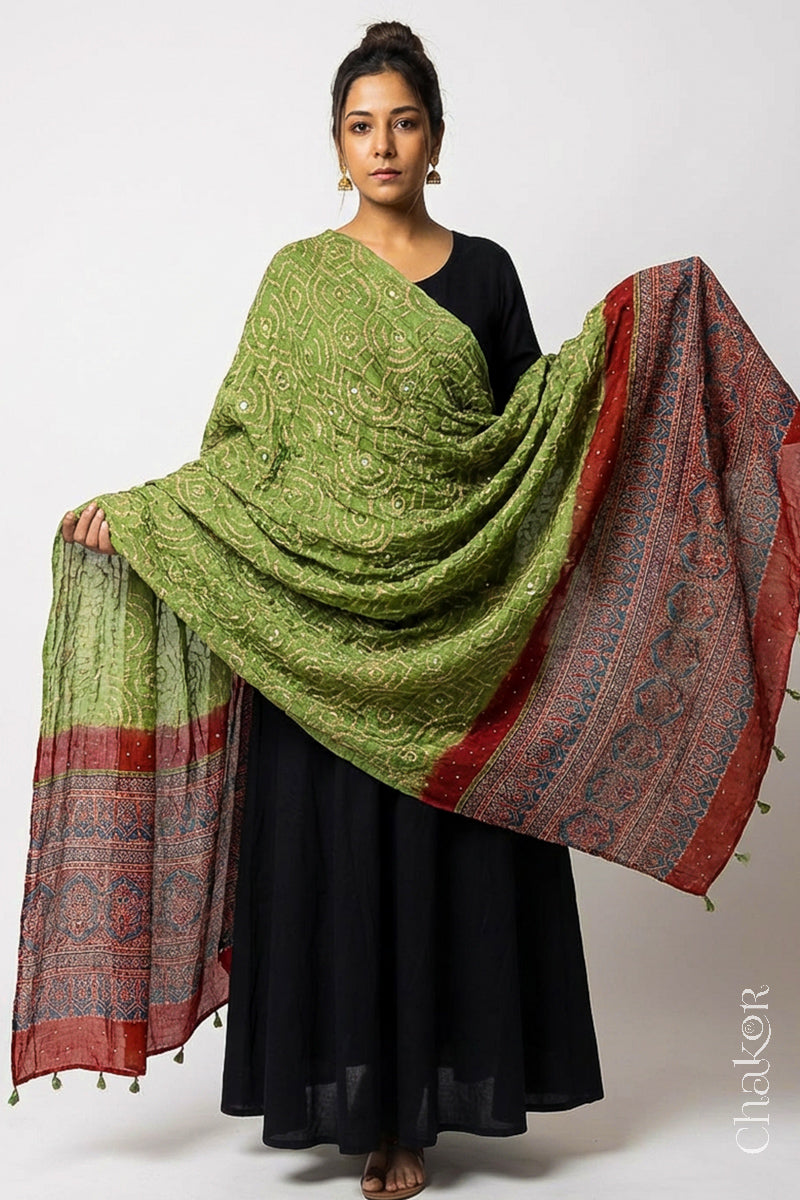 Model wearing leaf green Bandhani gaji silk dupatta with Ajrakh border and brick red pallu.