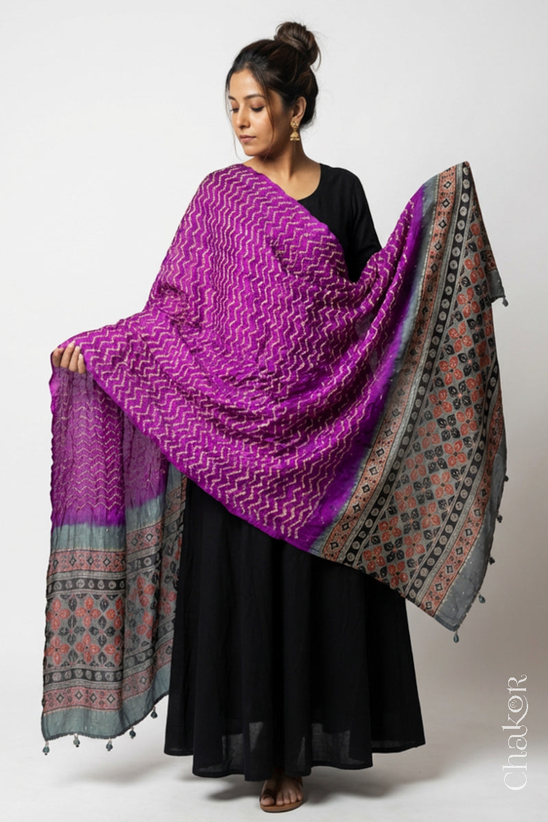 Model wearing magenta Bandhani gaji silk dupatta with Indigo Ajrakh printed contrasting pallu.