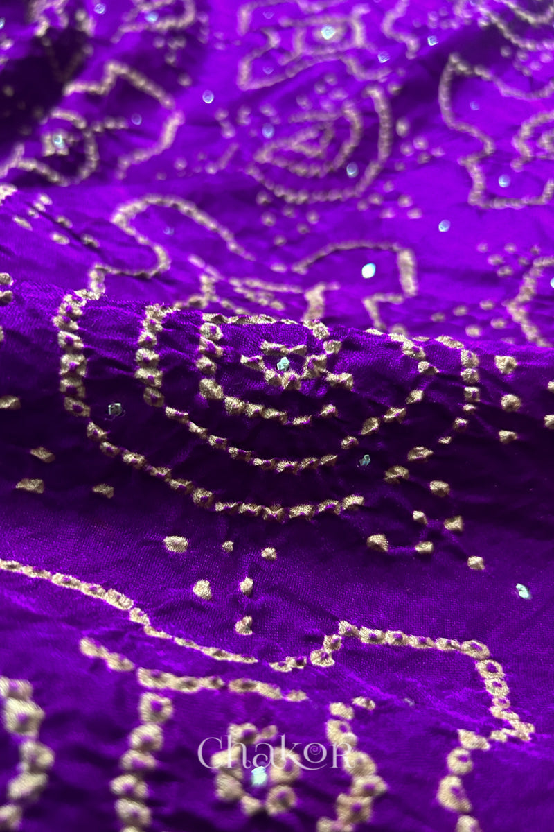 Detail of purple Bandhani gaji silk dupatta showing circular tie-dye motifs with metallic dots.