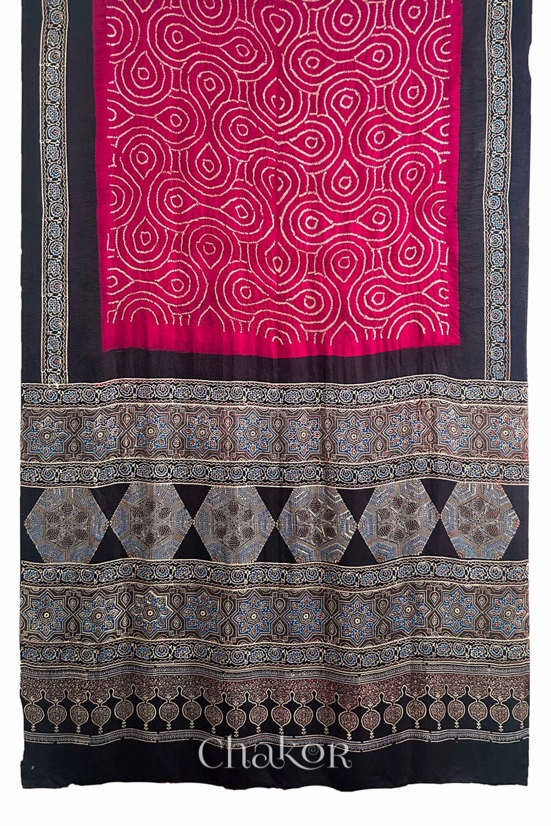 Full view of Red Bandhani Saree with Black Ajrakh printed border and pallu in pure gaji silk with traditional bandhej tie-dye, handcrafted in Kutch. 