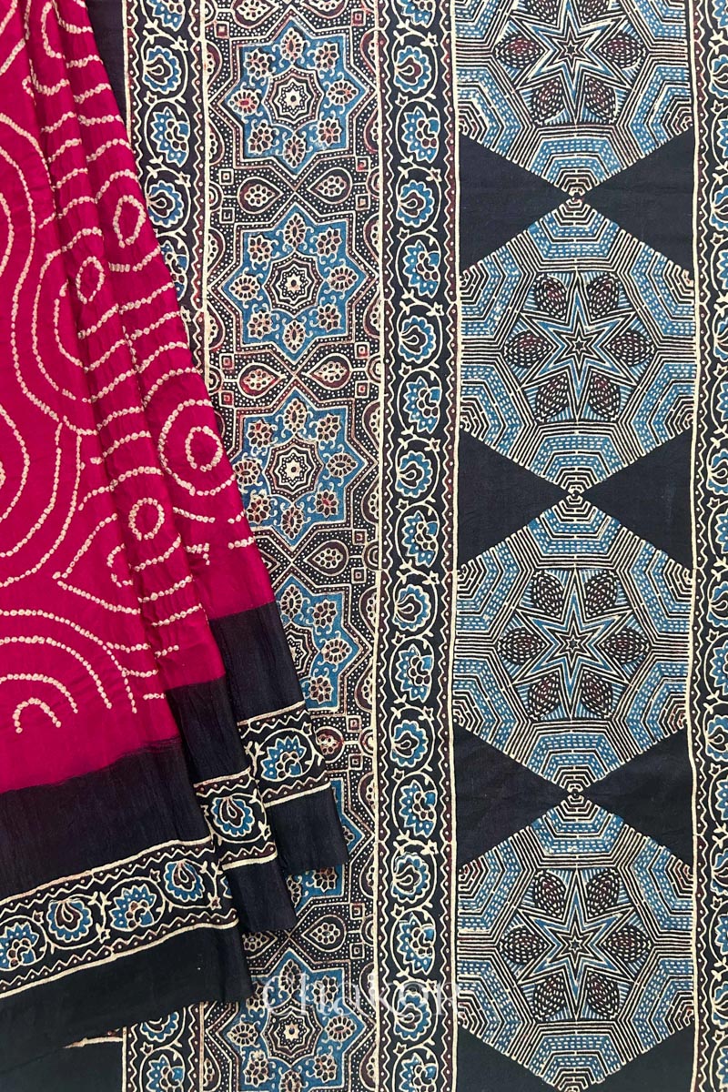 Close up of Red Bandhani Saree with Black Ajrakh printed border and pallu in pure gaji silk with traditional bandhej tie-dye, handcrafted in Kutch. 