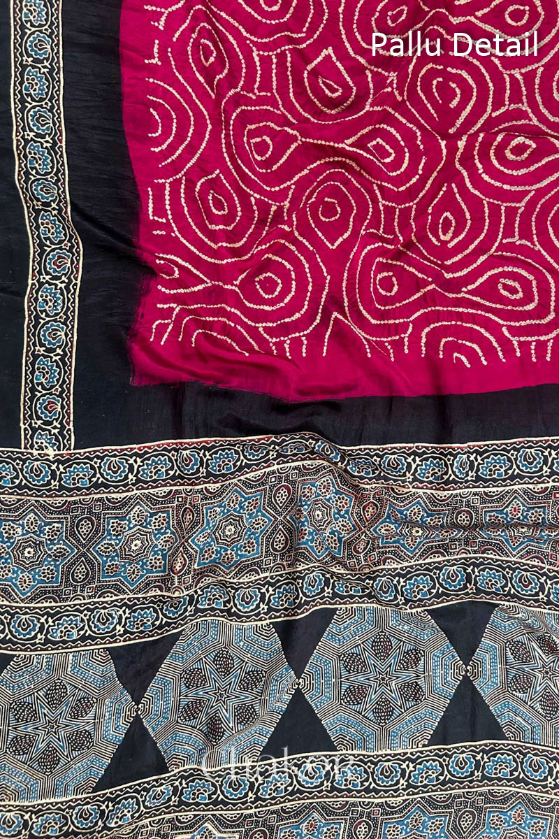 Close up of Red Bandhani Saree with Black Ajrakh printed border and pallu in pure gaji silk with traditional bandhej tie-dye, handcrafted in Kutch. 
