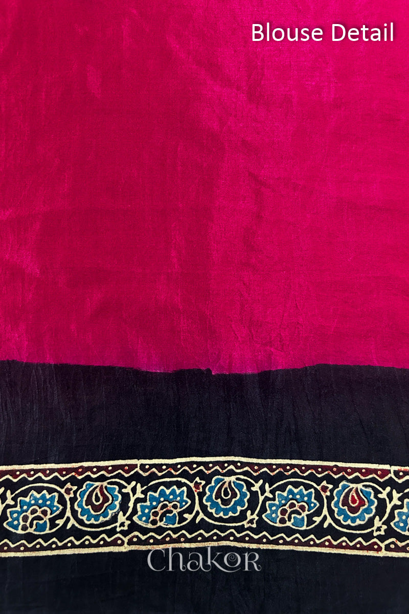 Close up of Red Bandhani Saree with Black Ajrakh printed border and pallu in pure gaji silk with traditional bandhej tie-dye, handcrafted in Kutch. 