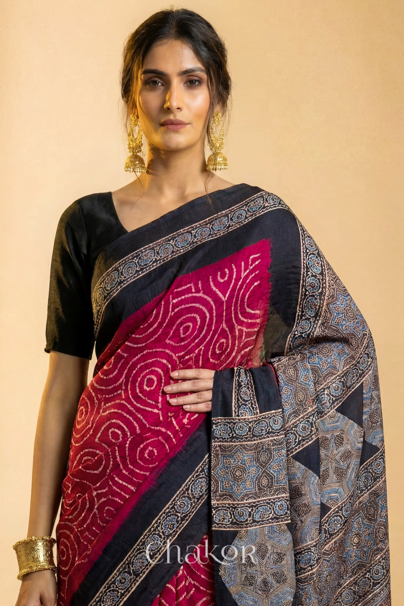 Close up of Red Bandhani Saree with Black Ajrakh printed border and pallu in pure gaji silk with traditional bandhej tie-dye, handcrafted in Kutch. 
