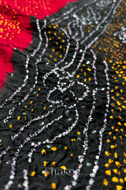 Close-up of Red black bandhani gaji silk dupatta with mukaish embroidery & tassels handcrafted in kutch - CHAKOR.