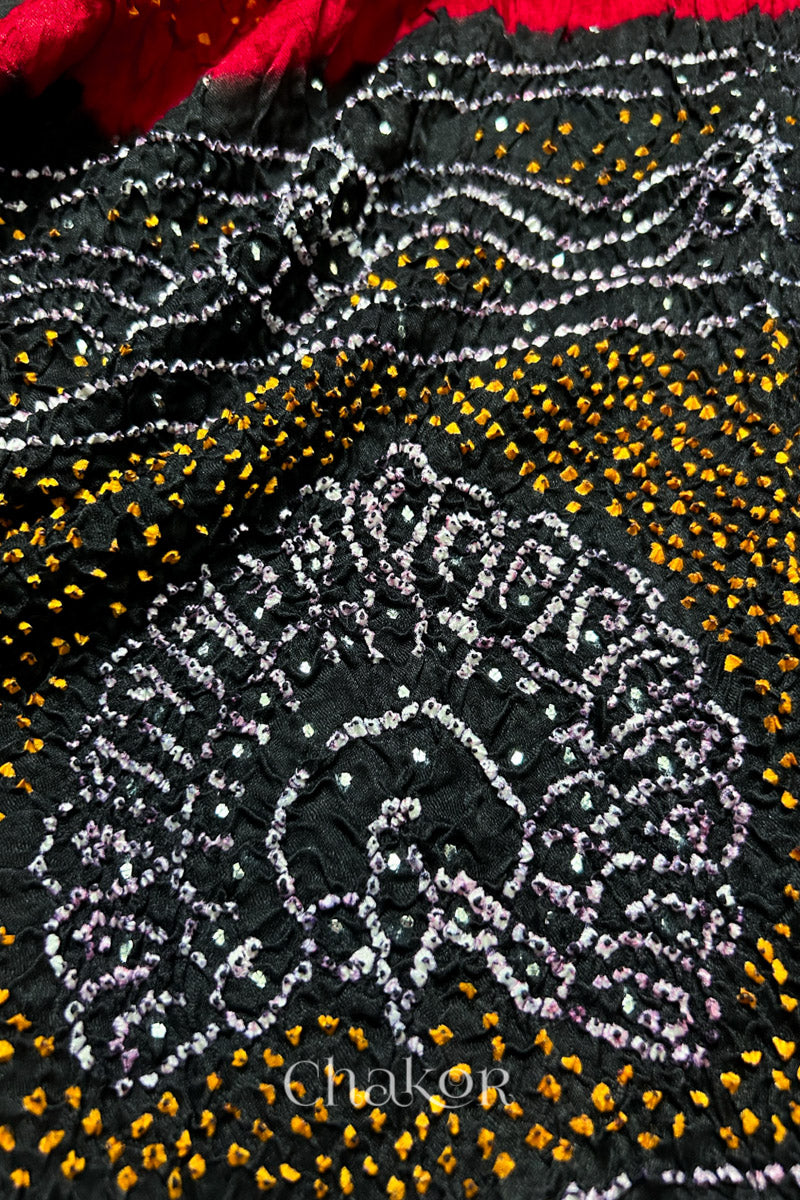 Close-up of Red black bandhani gaji silk dupatta with mukaish embroidery & tassels handcrafted in kutch - CHAKOR.