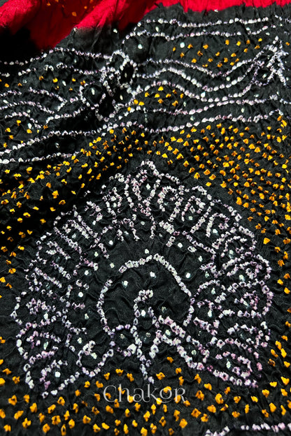 Close-up of Red black bandhani gaji silk dupatta with mukaish embroidery & tassels handcrafted in kutch - CHAKOR.