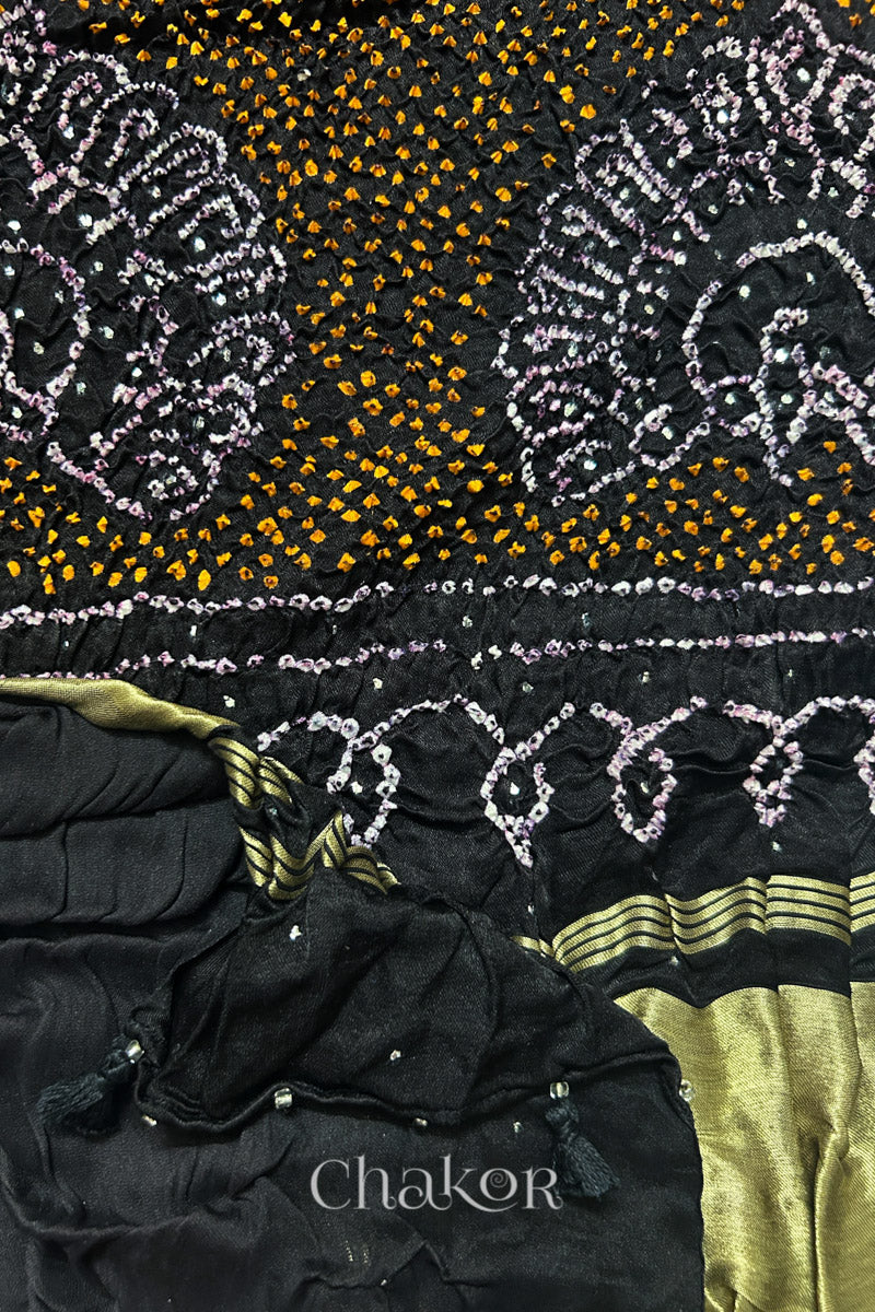 Close-up of Red black bandhani gaji silk dupatta with mukaish embroidery & tassels handcrafted in kutch - CHAKOR.