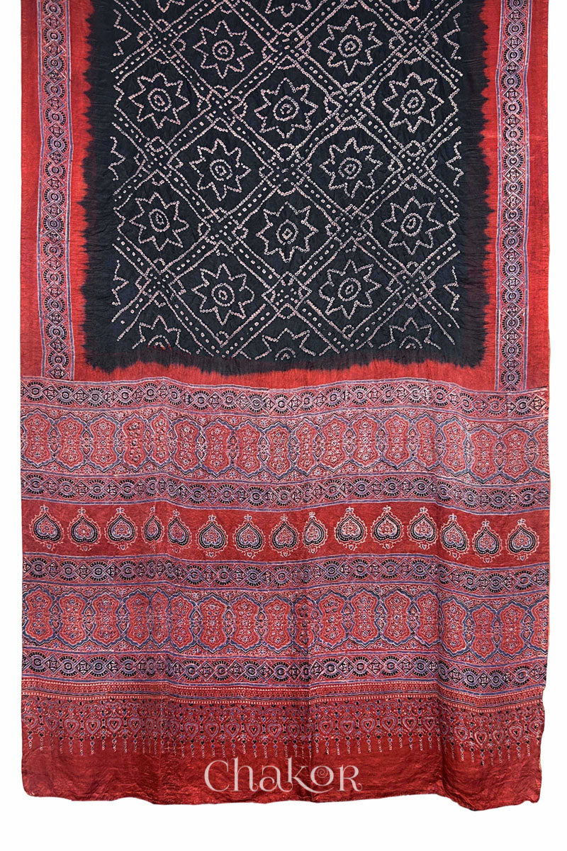 Full view of Black Bandhani Saree with Natural Red Ajrakh printed border and pallu in pure gaji silk with traditional bandhej tie-dye, handcrafted in Kutch. 