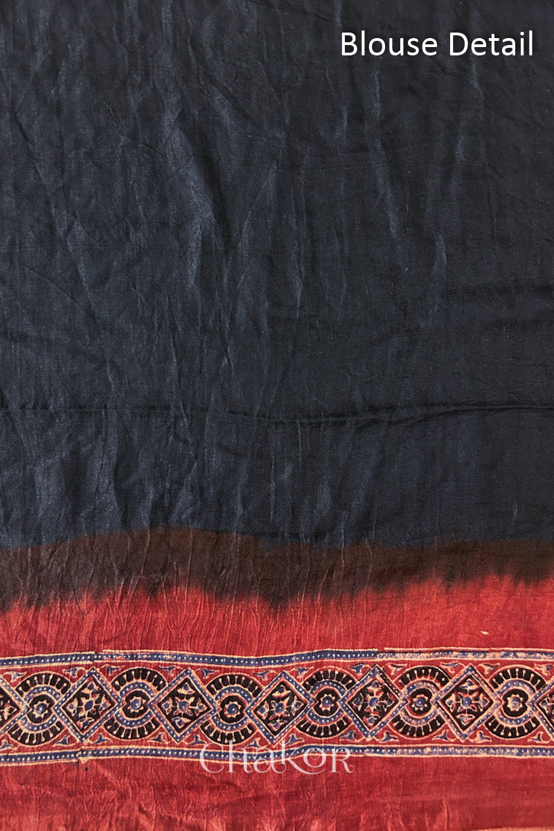 Blouse Material of Black Bandhani Saree with Natural Red Ajrakh printed border and pallu in pure gaji silk with traditional bandhej tie-dye, handcrafted in Kutch. 