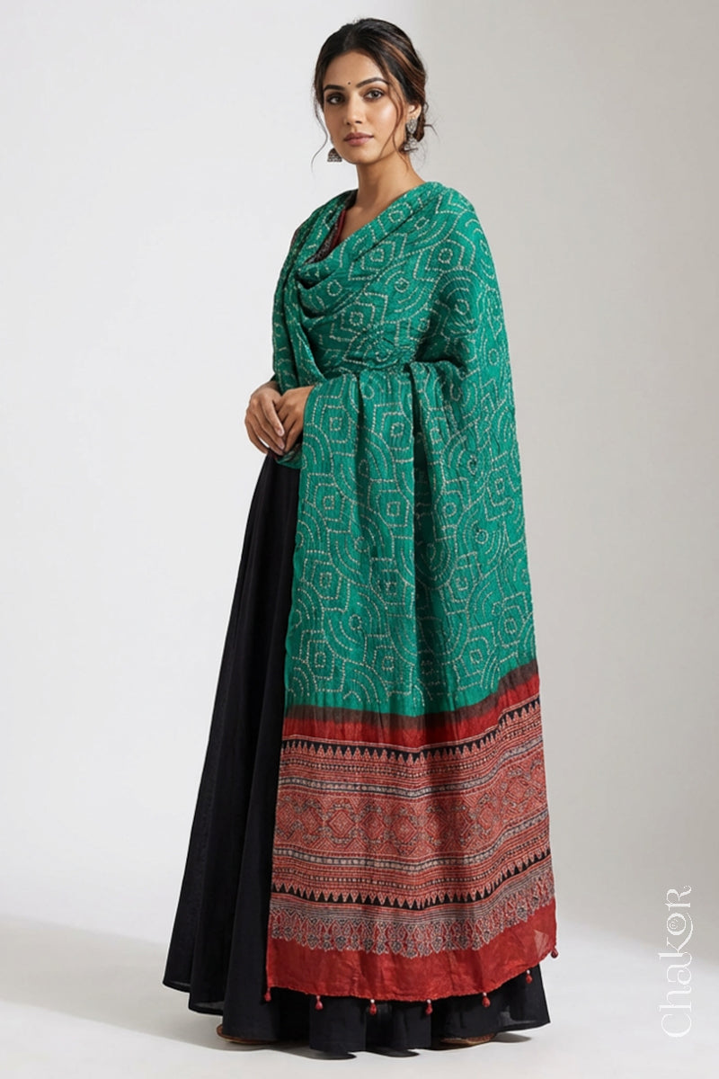 Model wearing jade green Bandhani gaji silk dupatta with Ajrakh border and rust red pallu.