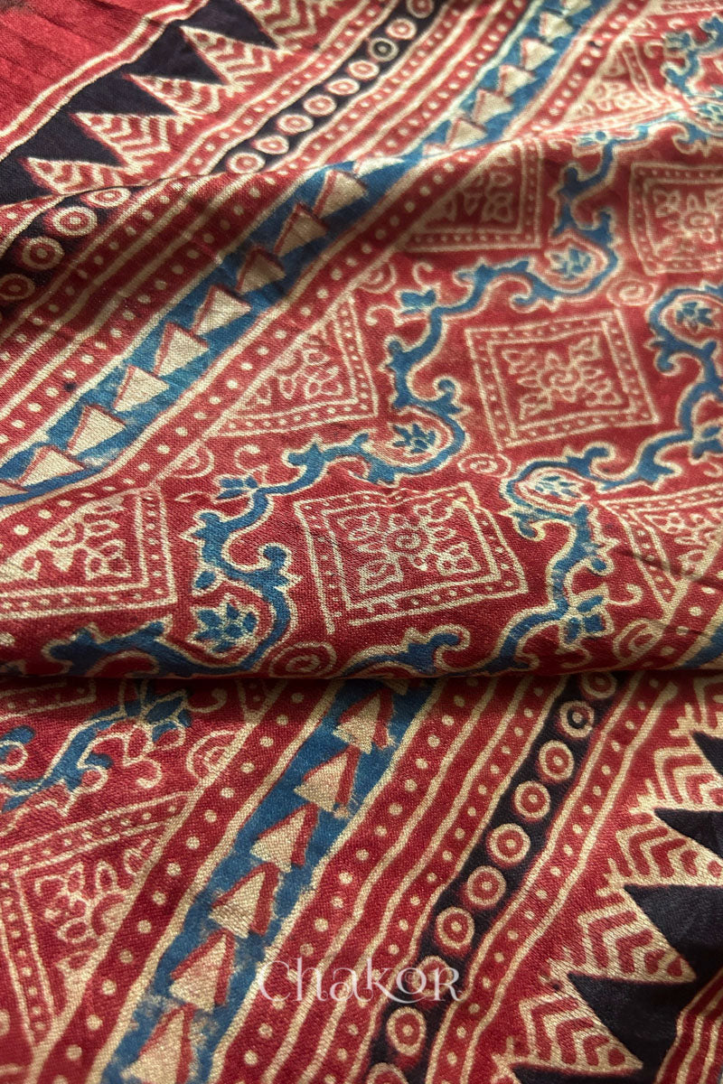 Close-up of Ajrakh print border on jade green Bandhani gaji silk dupatta.