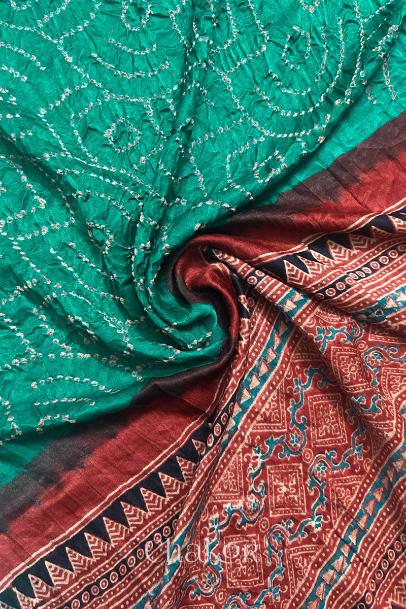 Draped detail view of jade green Bandhani gaji silk dupatta showing body pattern and pallu.