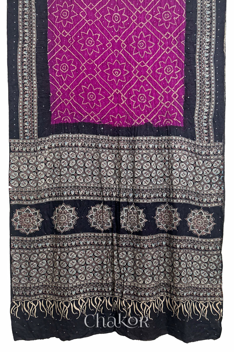 Full view of Magenta Bandhani Saree with Natural Black Ajrakh printed border and pallu in pure gaji silk with traditional bandhej tie-dye & mukaish embroidery, handcrafted in Kutch. 