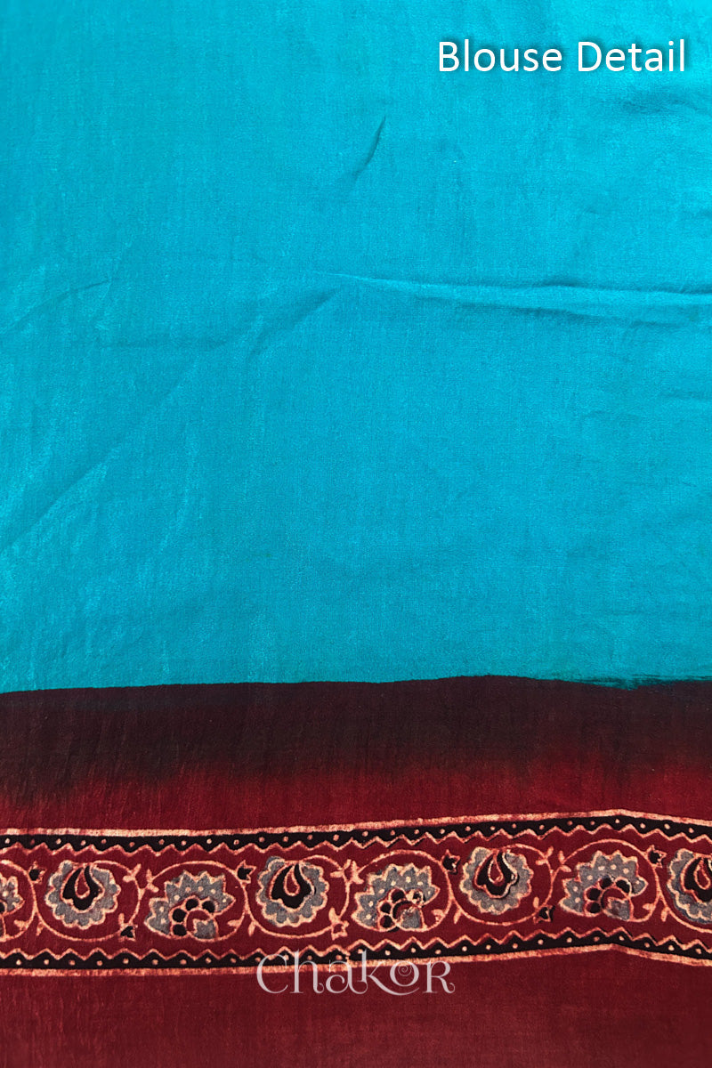 Blouse Material of Peacock Blue Bandhani Saree with Natural Red Ajrakh printed border and pallu in pure gaji silk with traditional bandhej tie-dye & mukaish embroidery, handcrafted in Kutch. 