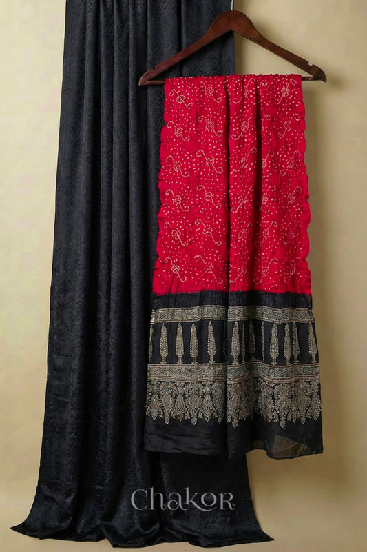 Black mashru kurta set fabric paired with red bandhani silk dupatta and ajrakh pallu.