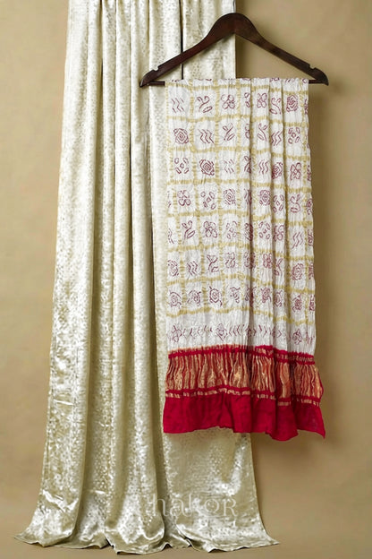 Off white mashru silk kurta set fabric with white & red bandhani gharchola gaji silk dupatta featuring red zari pallu.