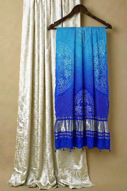 Off white mashru silk kurta set fabric with blue ombre bandhani  gaji silk dupatta featuring zari pallu & tassels.