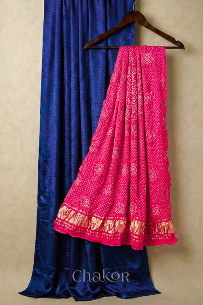 Royal Blue mashru silk kurta set fabric paired with coral bandhani gaji silk dupatta featuring golden zari pallu.