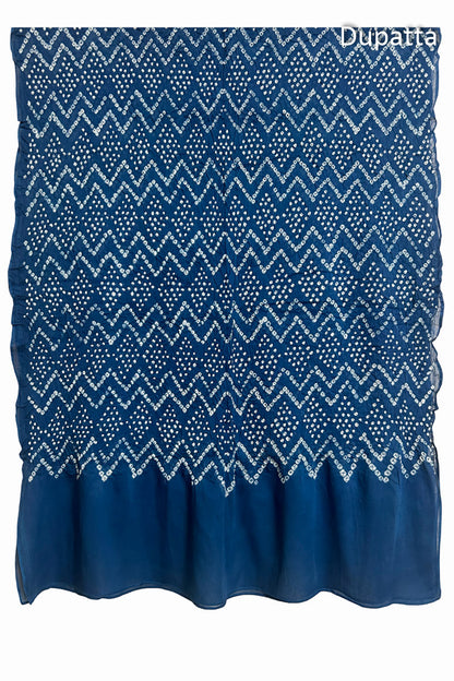 Full view of the indigo blue dupatta from the kurta set with intricate zigzag bandhani patterns, with Chakor logo. The design showcases artisanal craftsmanship.
