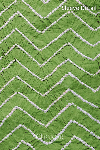 Close-up of bandhani sleeve detail featuring chevron tie-dye design, with Chakor brand logo.
