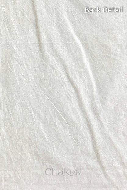 Close-up of plain back of the kurta fabric with Chakor brand logo. Text reads back detail.
