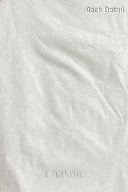 Close-up of plain back of the kurta fabric with Chakor brand logo. Text reads back detail.