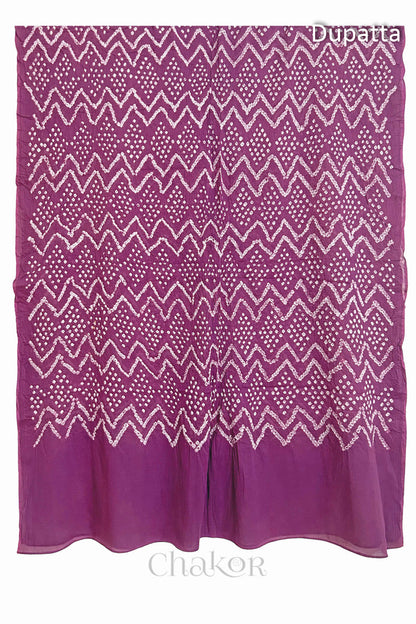 Full view of the deep violet dupatta from the kurta set with intircate zigzag bandhani patterns,  with Chakor logo. The design showcases artisanal craftsmanship.