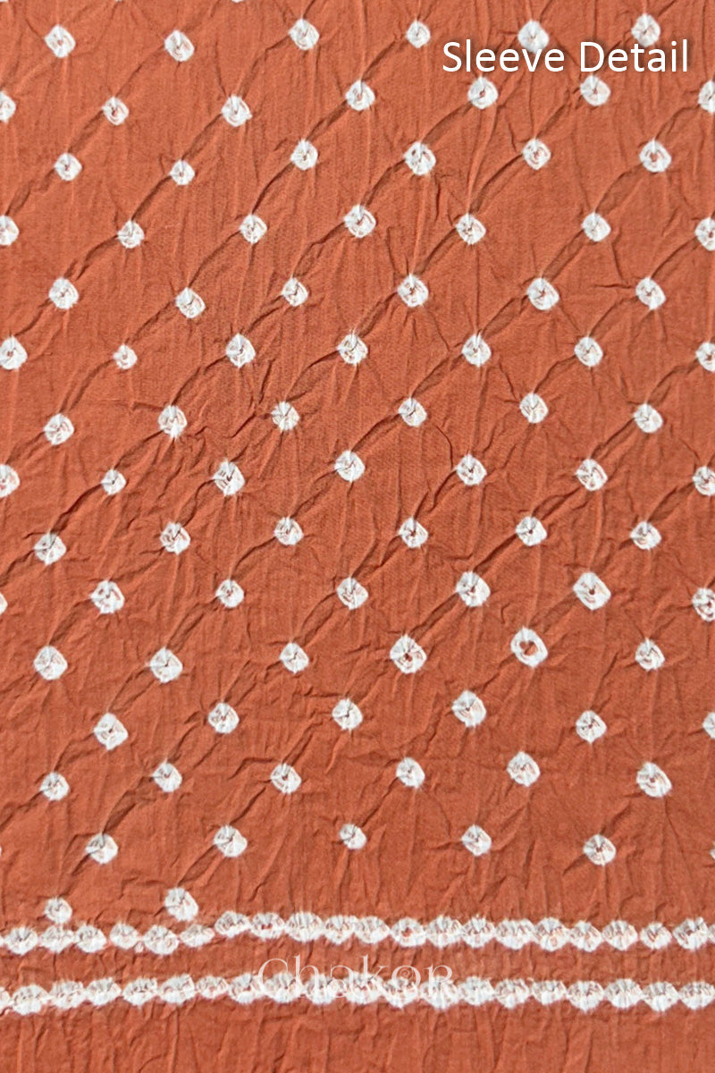Bandhani dotted sleeve pattern on mercerised cotton fabric with handcrafted tie dye work.
